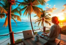 Digital nomad working on a laptop with a sunset view.
