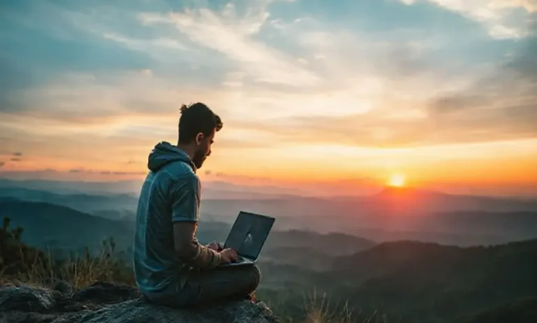 Um nômade digital em um local bonito, trabalhando ao amanhecer.