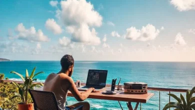 Espaço de trabalho de um nômade digital com vista para o oceano.