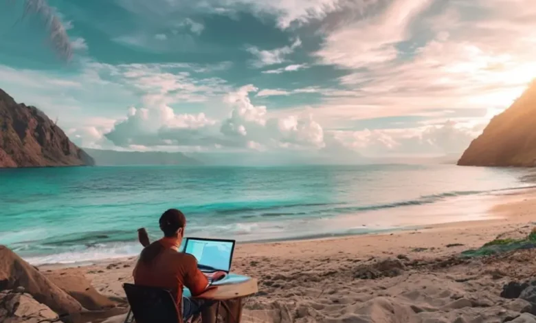 Nômade digital utilizando um laptop em uma praia, simbolizando liberdade e empreendedorismo.