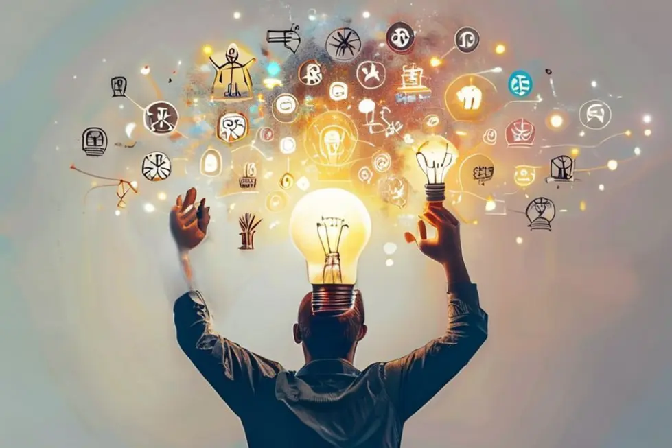 Desmistificando o Empreendedorismo: 7 Verdades e Mitos que Você Precisa Saber - Web Nômade Digital Uma pessoa com uma lâmpada simbolizando ideias iluminadas sobre empreendedorismo.