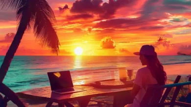 Nômade digital trabalhando em um café à beira-mar, simbolizando a liberdade e a flexibilidade do trabalho remoto.