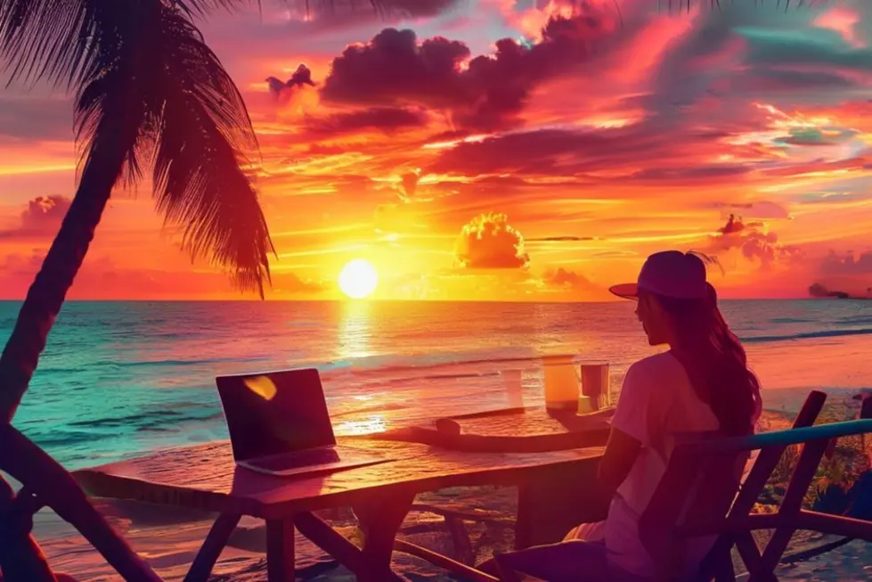 Nômade digital trabalhando em um café à beira-mar, simbolizando a liberdade e a flexibilidade do trabalho remoto.