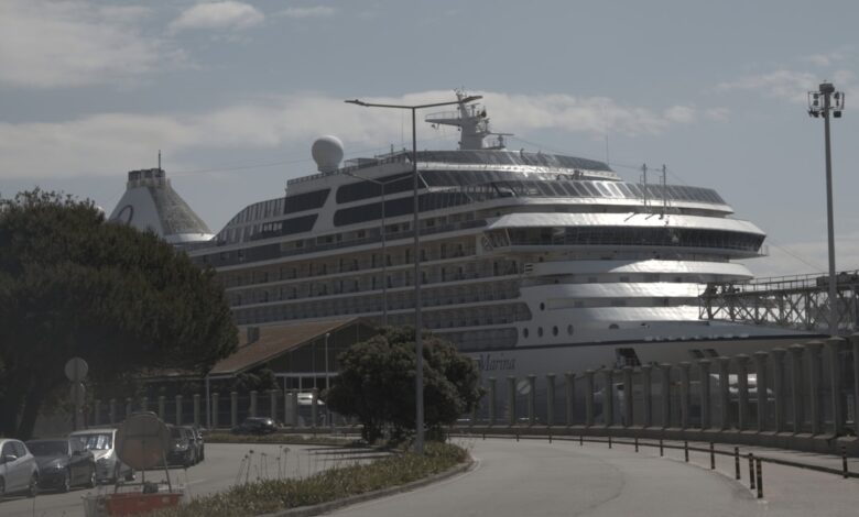 A large cruise ship docked in a harbor