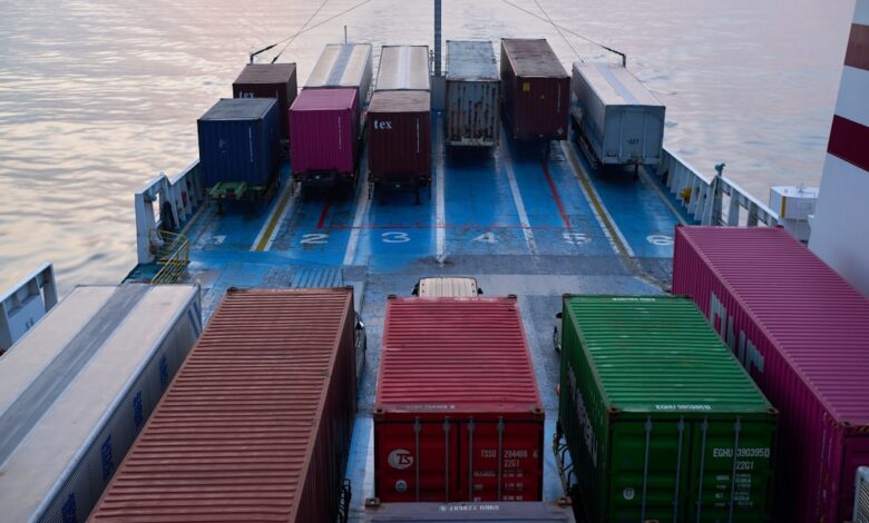 A large boat with lots of containers on it