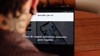 A person sitting at a table with a laptop