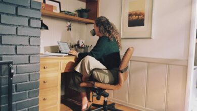 Woman working at desk with coffee