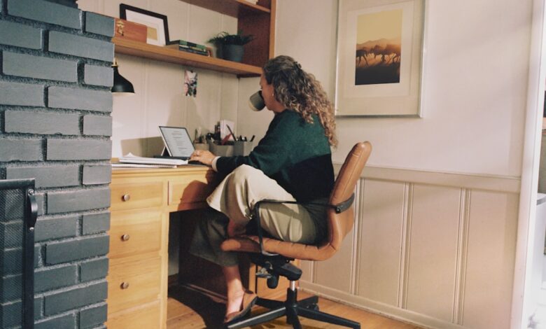 Woman working at desk with coffee