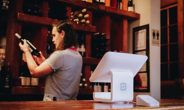 woman standing and looking on bottle