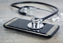 a smart phone with a stethoscope on top of it