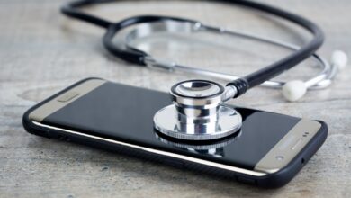a smart phone with a stethoscope on top of it