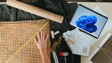 a person is working on a project with a laptop