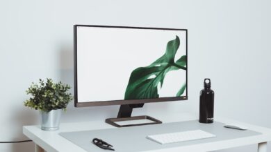 a computer monitor sitting on top of a white desk