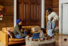 a group of people sitting around a living room