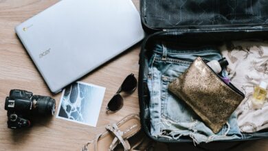 Como Escolher o Destino Ideal para sua Workation - Web Nômade Digital black DSLR camera near sunglasses and bag