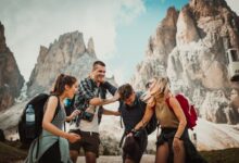 low-angle photography of two men playing beside two women