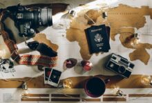 black DSLR camera near passport