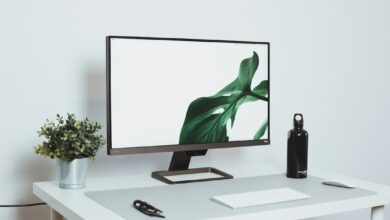 a computer monitor sitting on top of a white desk