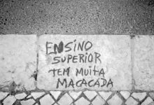 a cement wall with graffiti written on it