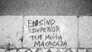 a cement wall with graffiti written on it