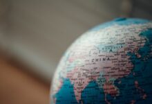 close up photo of blue desk globe