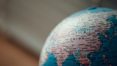 close up photo of blue desk globe